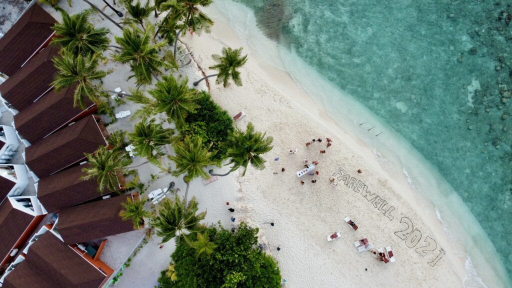 Secluded beach on Fodhdhoo Island with sunbeds, offering tourists a quiet, crowd-free experience in the Maldives