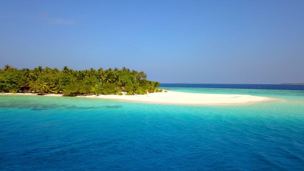 Uninhabited island near Fodhdhoo, a peaceful escape during your stay at a guest house in Maldives.