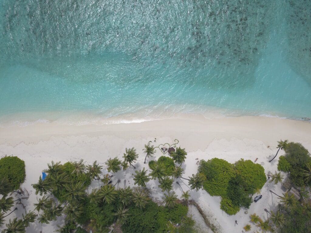 Aerial view of the bikini beach near Sabba Beach Hotels, highlighting the beauty of a guest house in Maldives.