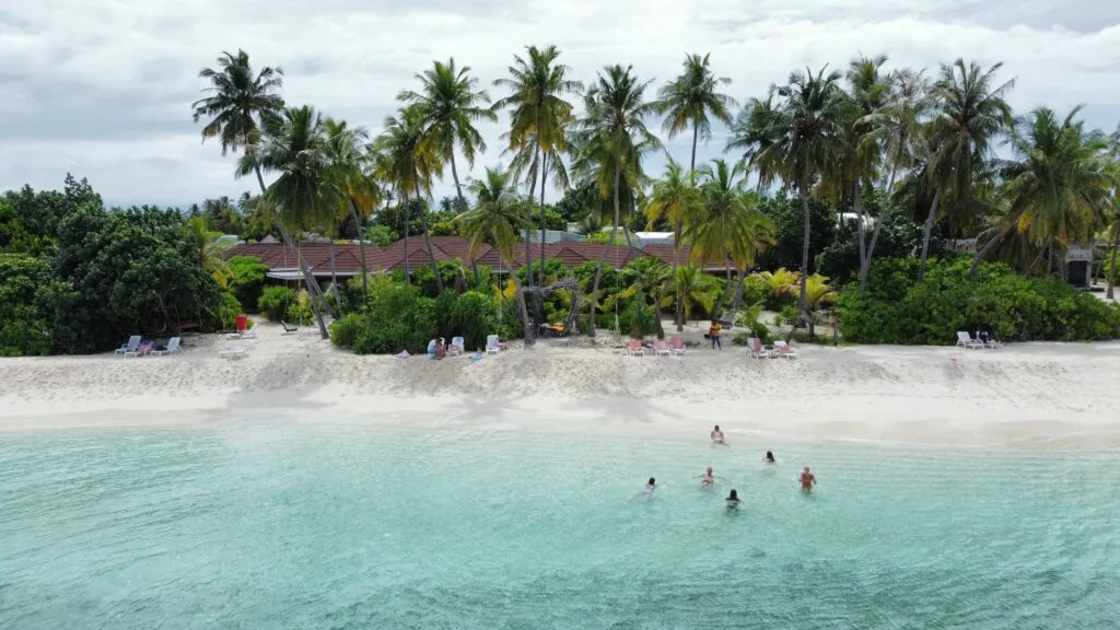 Snorkeling in clear waters around Fodhdhoo Island, discovering vibrant marine life.