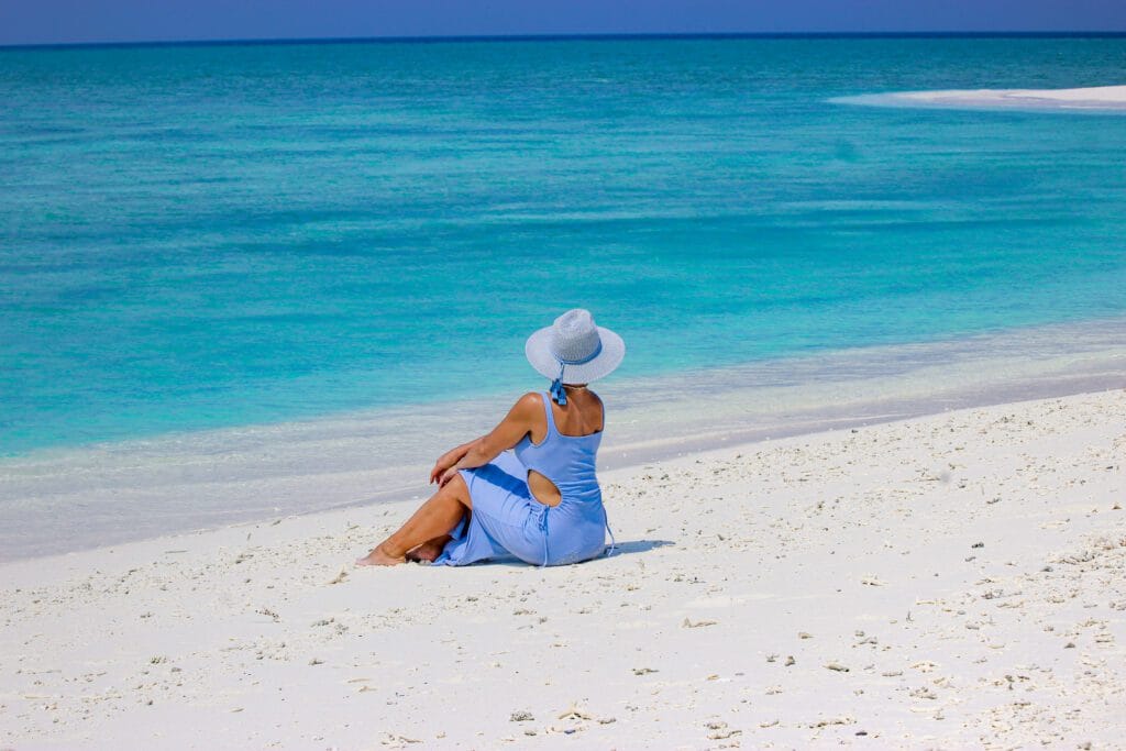 A guest relaxing on a sunny day at Sabba Beach Hotels, enjoying their vacation at Maldives.