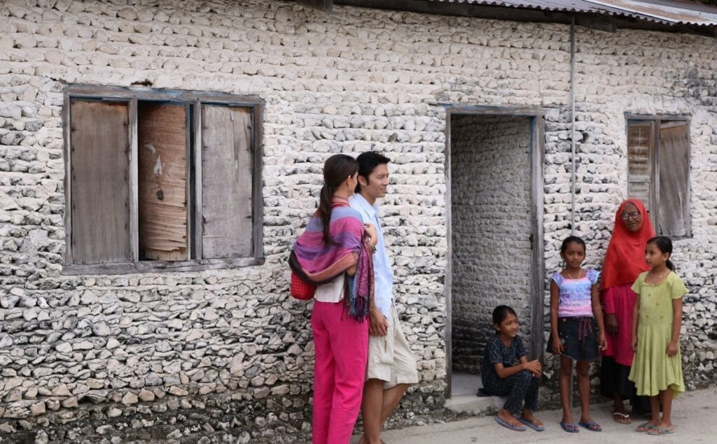 Guest exploring the local village on Fodhdhoo Island, engaging with Maldivian culture.