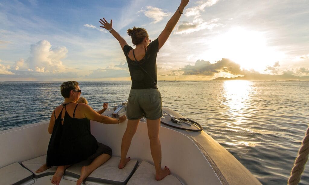 Honeymoon couple on a private sunset cruise in the Maldives near Sabba Beach Hotels.