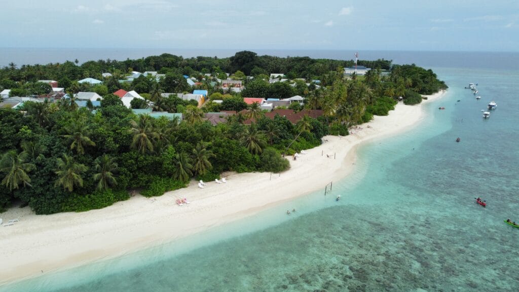 Aerial picture of Fodhdhoo island with beach, great for Maldives beach vacation on a budget