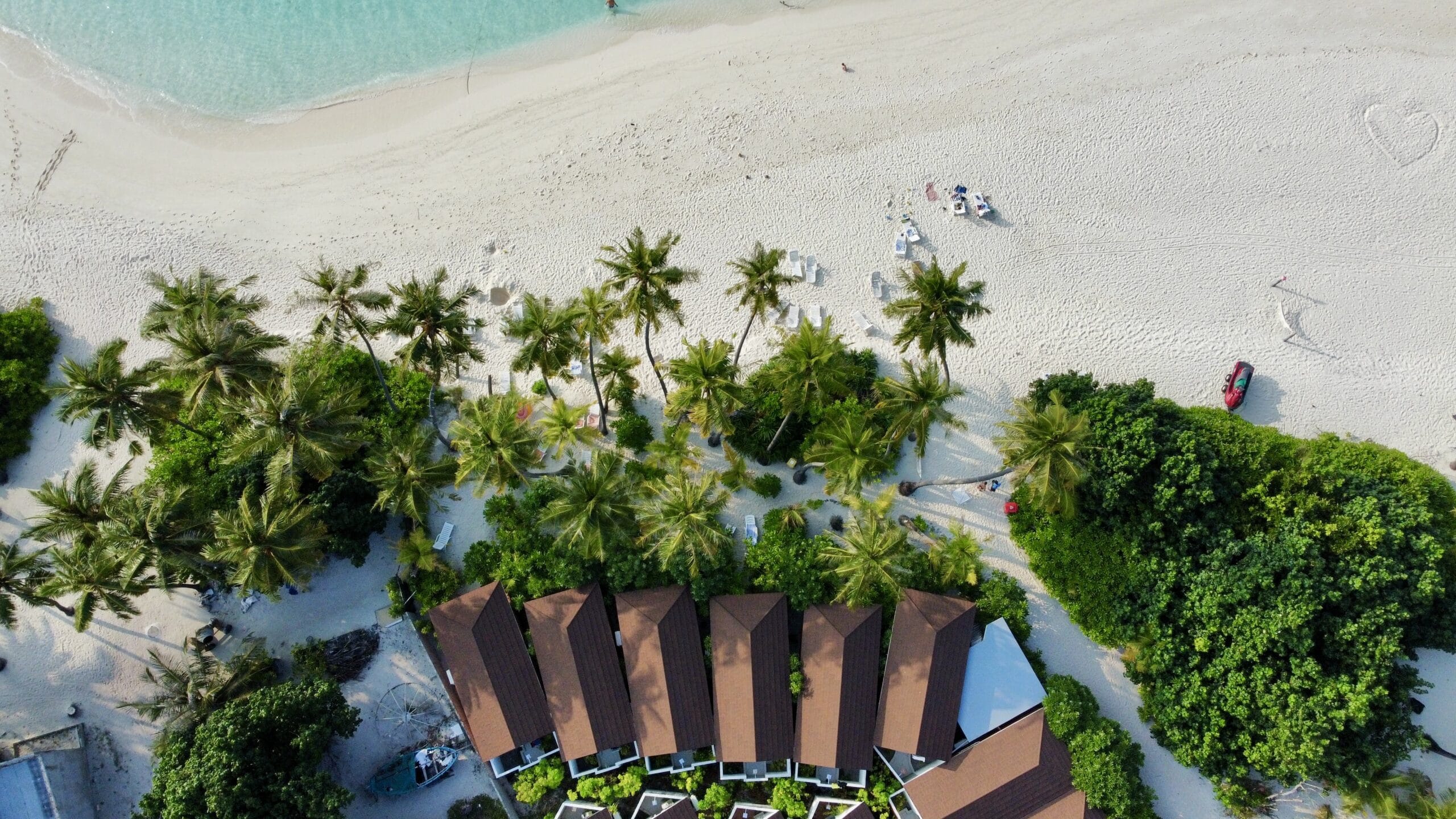 Sweeping aerial view of Sabba Beach Villas and Bikini Beach framed by turquoise waters