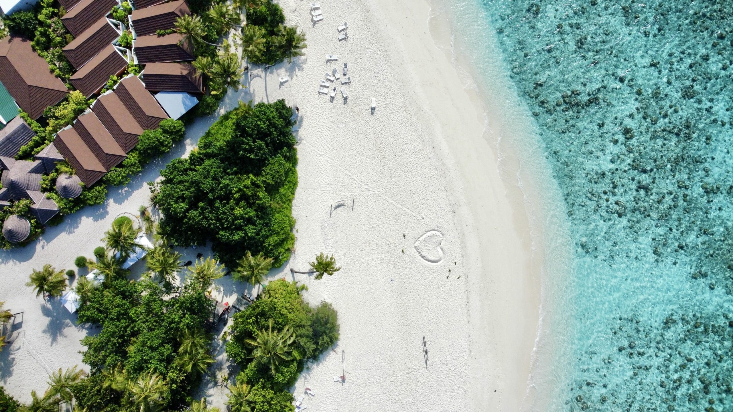 Sunlit Bikini Beach inviting travelers to a blissful Holiday at Maldives by the water