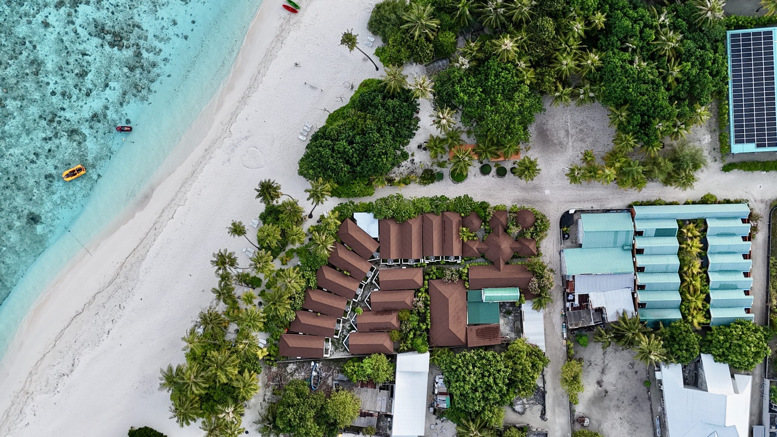Aerial panorama of Sabba Beach Hotels with beachfront restaurant and calm Bikini Beach nearby